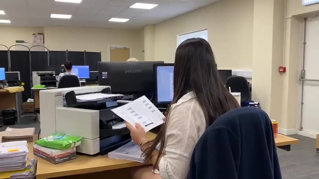 Documents being prepared for scanning